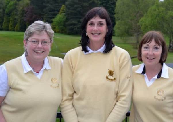 Valerie Rooney and Daphne Houston with team captain Julie Robinson (centre).