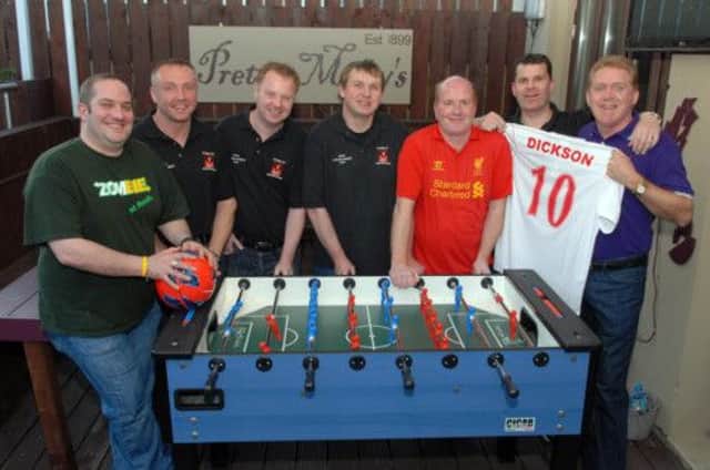 First Moira Liverpool Supporters Club members, Peter Martin, Barry White, Mark McCormick, Ian Houston, Paul Stirling, chairman, Michael Bradley, captain and Gary Dickson, manager prepare for their trip to Anfield. INLM20-108gc