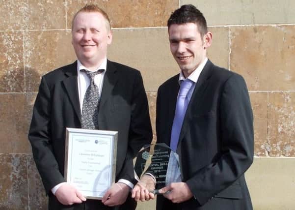 Lawrence McCullaugh pictured with his award with fellow Cedar Service user Paul McDermott.  INLM22-001