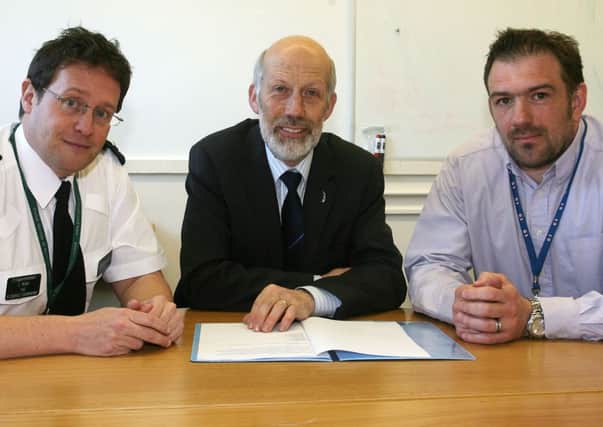 Justice Minister David Ford pictured during his recent meeting with Chief Superintendent Chris Noble (Area commander H district) and Detective Sergeant Paul Mercer. INBT22-202AC