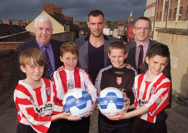 Everton star Darron Gibson pictured with some of the members of the Derry & District Youth League Squad at the launch of the Hughes Insurance Foyle Cup in the Tower Hotel on Thursday night. Included are Michael Hutton, Derry & District Youth FA, and Gareth Finlay, Hughes Insurance. INLS2213-119KM