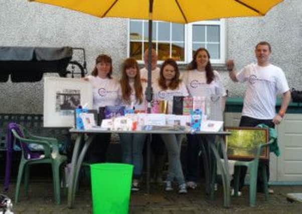 Volunteers with raffle prizes.