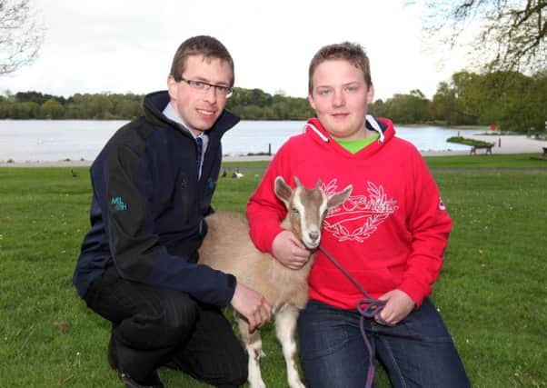 John Harrison and Jamie Bunting, representatives of Lurgan Show, posing with one of this year's show entrants.