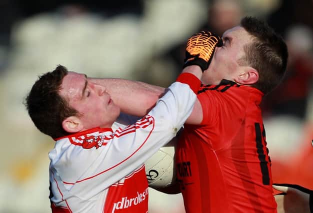 ©Press Eye Ltd Northern Ireland- 22nd January 2012 Mandatory Credit - Photo-William Cherry/Presseye

Power NI Dr McKenna Cup semi-final -  Derry v Down

Derry's Ryan Dillon with Down's Kalum King during Sundays Power NI Dr McKenna Cup semi-final match at Athletic Grounds, Armagh