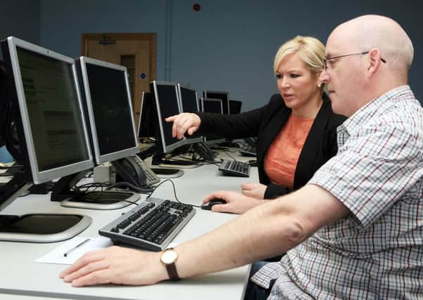 ©/Lorcan Doherty Photography - November 2nd 2011. 

NO FEE FOR REPRODUCTION

Agriculture Minister visit Orchard House, Derry.

Agriculture Minister Michelle O'Neill views the Single Farm Payments online system with staff member Chris Nash, during a visit to the DARD office at Orchard House, Derry.
 
Photo Lorcan Doherty Photography