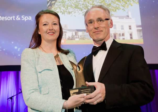 The Hotel Accommodation award, sponsored by Invest NI, went to Galgorm Resort and Spa at this year's Northern Ireland Tourism Awards. Pictured are Loam McKeating from Invest NI and Beth Swindlehurst. Picture by Brian Morrison
