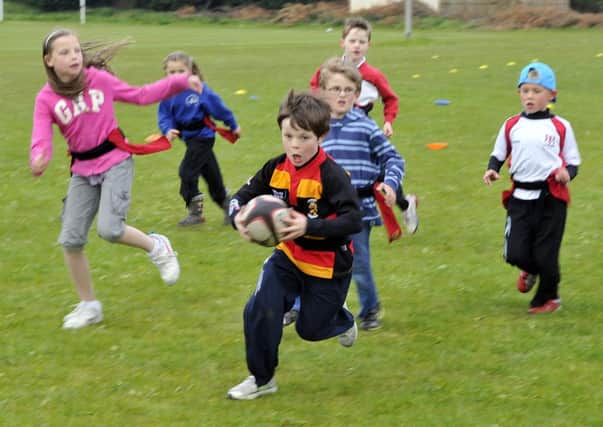 Matthew Spence runs with the ball in the tag rugby at the fun night. INLM23-107gc