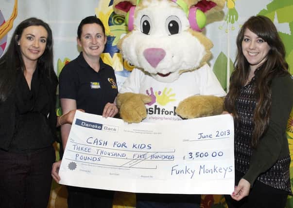 Funkey Monkeys, Lurgan, have raised £3500 for the Cash For Kids charity through various sponsored events including a staff head shave. Pictured at the presentation of the cheque are from left, Claire Toner, marketing manager, Lorraine Rice, owner of Funky Monkeys, Lurgan and Stephanie Laverty, charity  co-ordinator, Downtown Radio/Cool FM Cash for Kids. INLM23-211.
