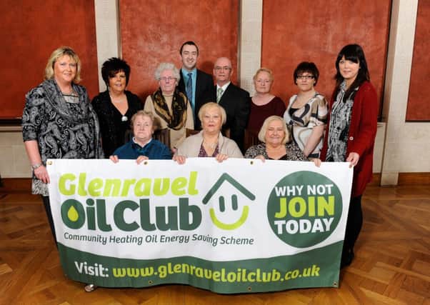 CLUB COMBATS FUEL POVERTY: Members of Glenravel Oil Club and Glenravel Cllr Paul Maguire pictured at a Tackling Fuel Poverty Together in Stormonts Long Gallery.