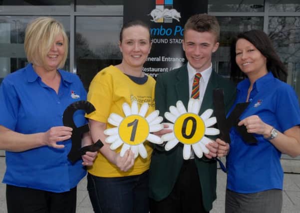 Celebrating Raising over £10,000 for Northern Ireland Cancer Fund for Children at Adam Kerr's Abseil Charity Event, Night at The Races at Drumbo Park are Gill Garrett, Drumbo, Briege Price, Northern Ireland Cancer Fund for Children, and Tract Gilbert. INUS1913-DRUMBO