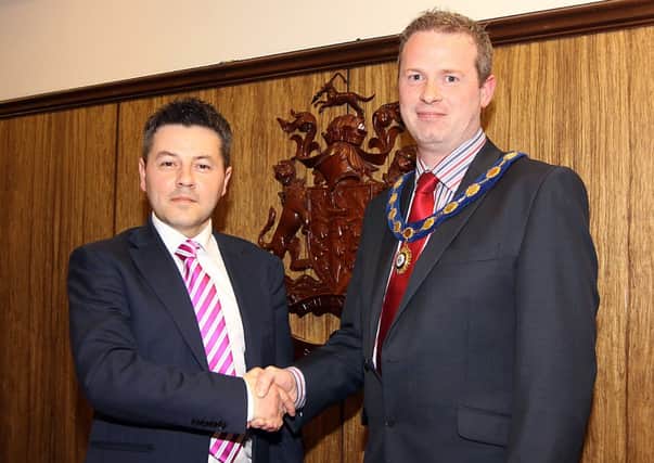 Councillor Alan Robinson the outgoing deputy Mayor of Limavady hands over the chain of office to Councillor James McCorkell, elected the new deputy Mayor of Limavady at the Council meeting on Monday night. INLV2213-355KDR