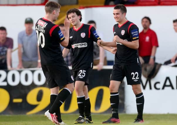 Derry City's Michael Duffy celebrates with Patrick McEleney and Barry McNamee after scoring his first senior goal for the club, at Shelbourne, on Saturday night.
