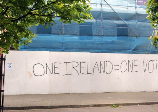 The writing on the hoarding in Draperstown. INMM2413-190ar.