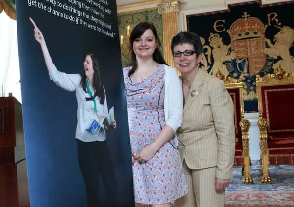 Claire Hinchliff, a volunteer with The 3rd Londonderry All Saints Scout Group is joined by Wendy Osborne, Volunteer Now at the Launch of Vounteering - Faces & Places, Hillsborough Castle.  Claire is one of 19 volunteers who are part of the photo exhibition.