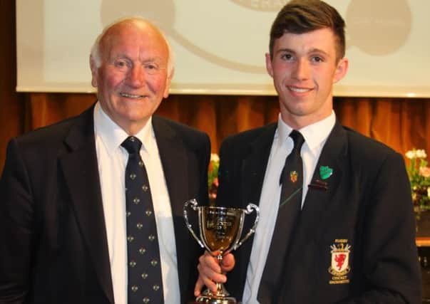 Raymond Hunter presents the WR Hunter Cup for Sporting Excellence to Year 14 pupil James McCallan at the Sports Awards Dinner last Thursday night.