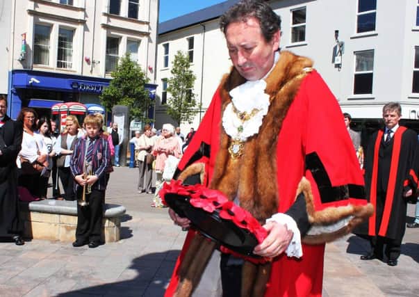 David Harding Mayor of Coleraine lays a wreath to mark 40 years to the day after an IRA bomb kiled six people.PICTURE MARK JAMIESON.