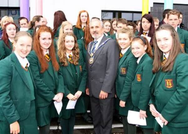 The Mayor of Limavady Councillor Gerry Mullan pictured with St Marys High School pupils who took part in the schools 400 voices in Limavady. INLV2413-024KDR