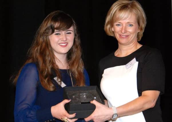 Claudia Green, University of Ulster, winner of the Interactive Media category, 1st place and commendation, is presented with her award by Kate Duffy, NWRC Director for Workforce Development & Administration.