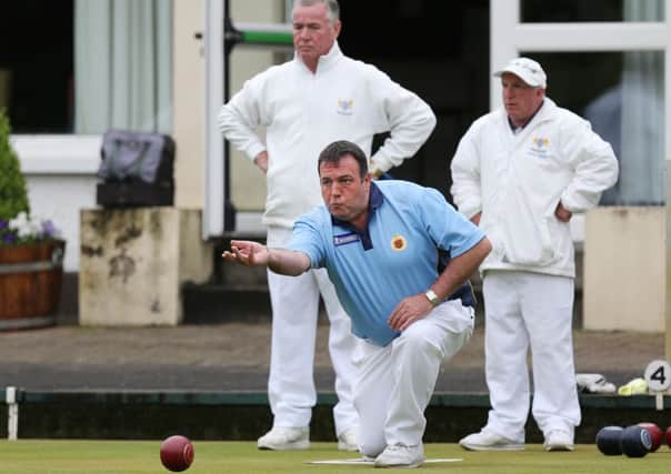 Ballymena's Ivan Lynn delivers a bowl in last week's Private Greens Junior League game against Belmont at the Old Ballymoney Road. INBT 25-171CS