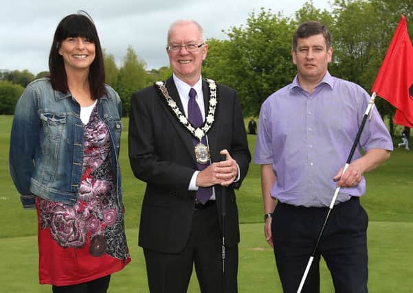At Ballyearl Golf Club are Newtownabbey Mayor Victor Robinson with Ursula Fay and John Cosgrove.
