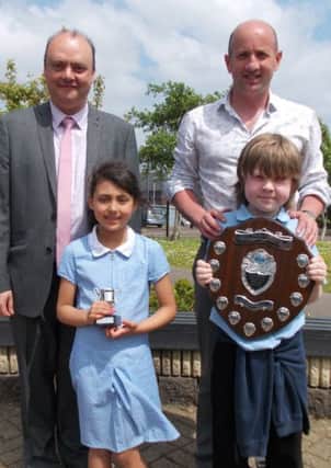 Prof. Dudley Shallcross (back left), Jim McDaid (science teacher), KS1 winner Makayla Weir (Why are roads salted in icy weather?) and KS2 & overall shield winner Sam McClelland (Can I grow my own bacteria?) INNT 25-518CON