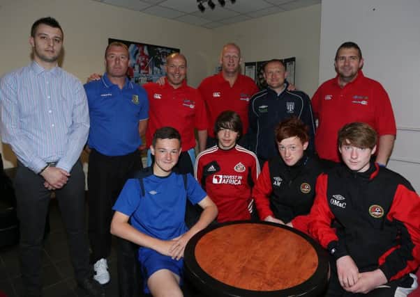 Former Northern Ireland star Iain Dowie with members of Ballymena United coaching staff and young footballers who attended Saturday's Iain Dowie Coaching School at the Michelin Athletic Club. Included are, L-R, Jason Connolly, Rab Caughey, Norman Kelly (Ballymena United), Iain Dowie, John Clarke, Clifford Adams (Ballymena United). INBT 25-180CS