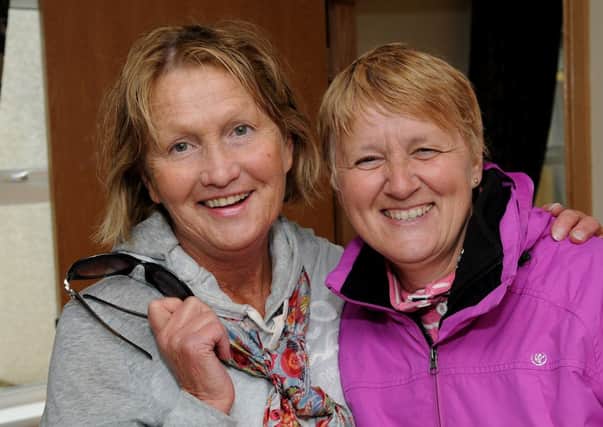 Charis Integrated Cancer Care Patron  Jenny Bristow and fund-raiser Valerie Beattie were still smiling after battling the cold and wet (and yes it was in June) to complete the Charis Lough Fea 4K Annual Walk in aid of Charis Integrated Cancer Care. INMM2613-127ar.