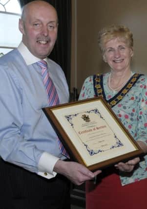 New Council Chairperson Cllr Olive Mercer presented Outgoing Chairman Cllr Junior McCrum with a Certificate of Service for his term in office © Edward Byrne Photography INBL24-227EB