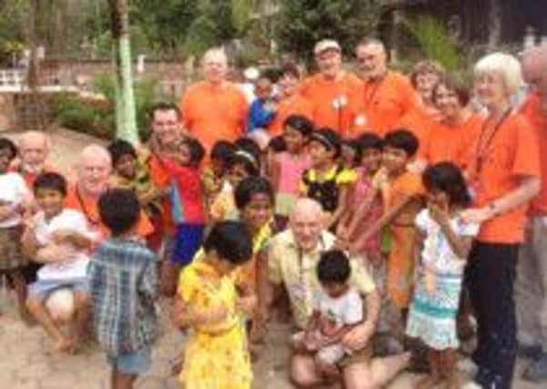 Grace Startin (back row holding the boy in the blue t-shirt) pictured with the LIFT team and some of the locals they met during their trip to Goa. INNT 26-500CON
