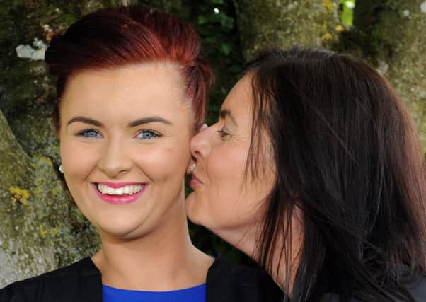 Amy Blair gets a big kiss from mum after she graduated with a BTEC National Diploma in Food Science and Manufacturing Technology at the Cafre Loughry Campus Awards Ceremony. INMM2613-182ar.