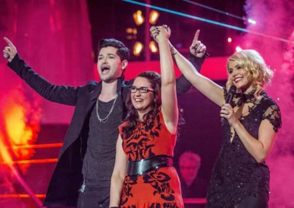 Andrea Begley from County Tyrone in Northern Ireland,  with Danny O'Donoghue and Holly Willoughby, after she was crowned the winner of the this year's BBC show The Voice.