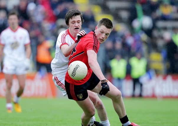 Tyrone's Chris Morris with Conor McGrady of Down. Picture Credit©INPHO/Morgan Treacy
