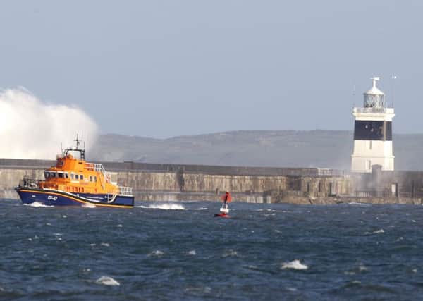 Holyhead breakwater during high seas. Six people died with the foundering of the MV Swanland in November 27, 2011. 
A mayday call was sent out from the ship at around 2am from 20-miles north-west of the Llyn peninsula in north Wales after the hull cracked.