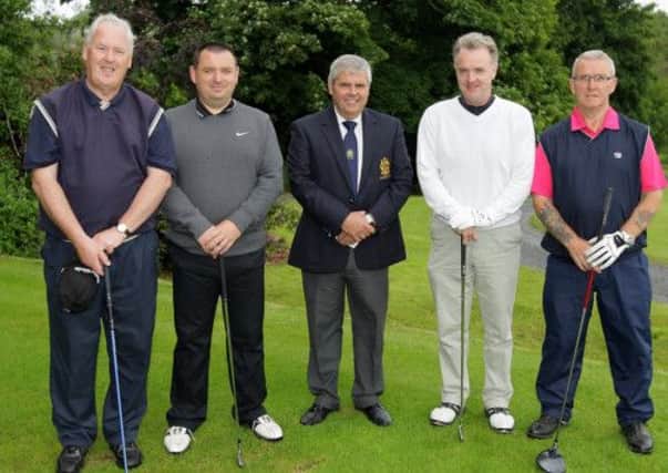 Lambeg captain Richie Gorman (centre) with Gerry McDonald, Desmond McKee, Mervyn McMaster and Sam Thompson taking part in captain's day at Lambeg Golf Club. US1326-511cd