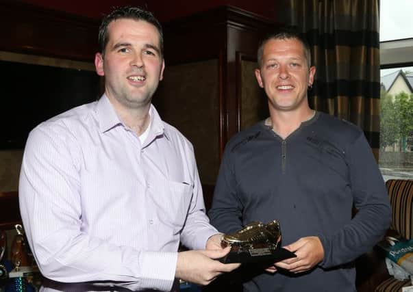 Woodside FC team captain Philip Davidson (left) presents the Ballymena & District Saturday Morning League Division 3 top goal scorer award to Trevor Richards at the club's awards evening in the Adair Arms Hotel. Trevor was unable to pick up his award at the league's dinner because he was away on holiday. INBT 25-190CS