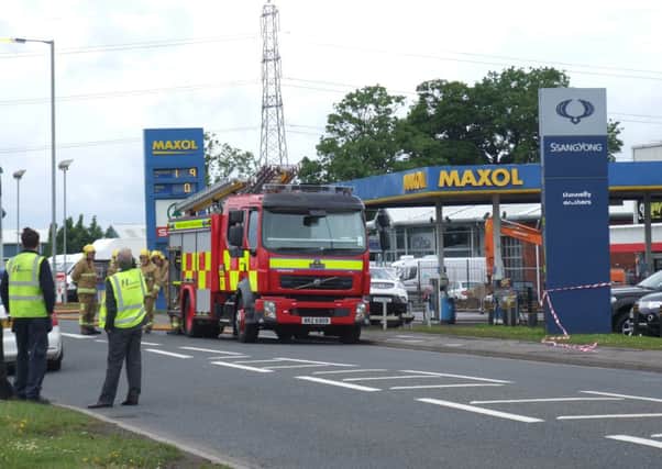 Fire crews arrive at commercial premises on the Mallusk Road following the report of a gas leak.