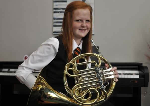 Holly Keery with her French Horn. INLM26-128gc