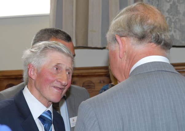 Matthew Gingles talks with Prince Charles. INLT 26-493-PR