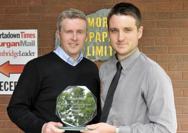Matthew Parks receives his Person To Be Proud of 2012 award from Michael Anderson, key account manager, Firmus Energy. INLM26-131gc