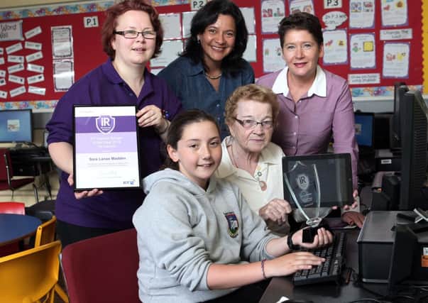 Ten year old  Sara Lanao Madden, from St Marys Primary School Bellaghy has been awarded the  Northern Ireland  BT Internet Ranger of the Year Award for 2013 for her outstanding efforts  teaching  others to get online.