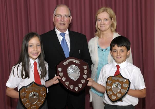 Vice Chairman of Donacloney Primary School Board of Governors Ivan Turkington presented the Garstin Shields for Excellence to P7 pupils  Rachel and Andrew who also shared the Armstrong Drama Shield © Edward Byrne Photography INBL27-201EB