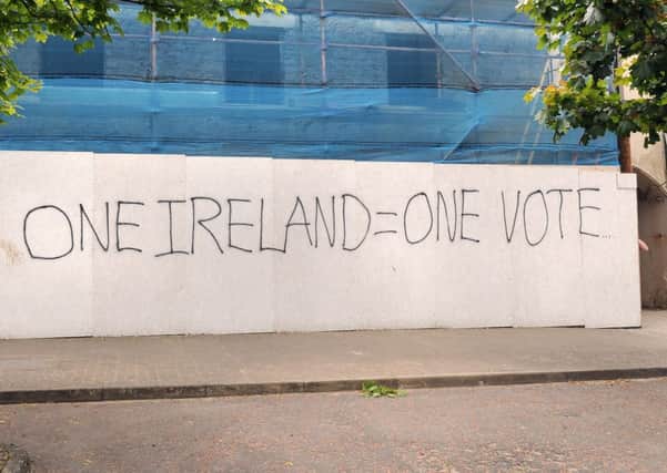 The writing on the hoarding in Draperstown. INMM2413-190ar.