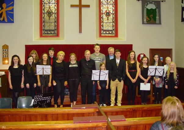 Rev Stephen Sheerin is pictured with members of Magherafelt Young Performers' Society and young members of the congregation at his final service in Magherafelt.
