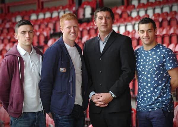 Derry City manager Declan Devine with new team signings, from left, Dean Jarvis, Eugene Ferry and Davy McDaid.
