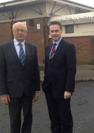 Cllrs Hubert Nicholl and Paul Frew welcome council's investment in refurbishment of Kells & Connor community centre.