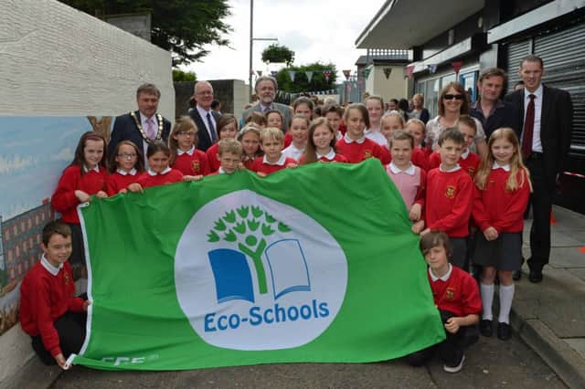 Pupils from Carnmoney Primary School's Eco Council are pictured with Mayor of Newtownabbey, Alderman Fraser Agnew, Councillor Victor Robinson, Rev John Dickinson, teacher Miss Bannon, local artist Michael Dunn and school principal Mr Brian Duff at Asher's Lane/Alleyway. INNT 28-027-PSB