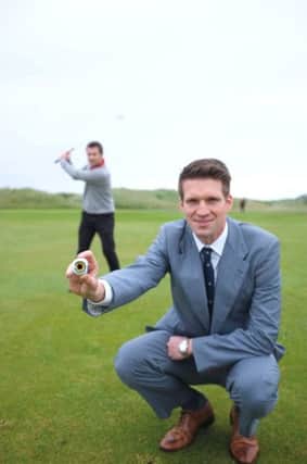 Caption:

Andrew Spence of Cathedral Eye Clinic, proud sponsors of the North of Ireland Championship 2013 and Patrick McCrudden, North of Ireland winner in 2011 demonstrate their eye for golf as they prepare to tee off for the Championship at Royal Portrush Golf Club.
