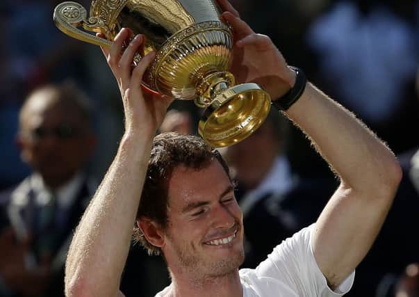 Great Britain's Andy Murray celebrates with the trophy.