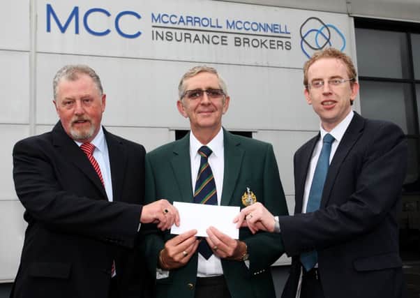 Sean McCarroll and Charlie McConnell, of McCarroll McConnell Insurance Brokers, present a sponsorship cheque to Harkness McCaughan, Honoury treasurer of Galgorm Castle Golf. INBT27-222AC