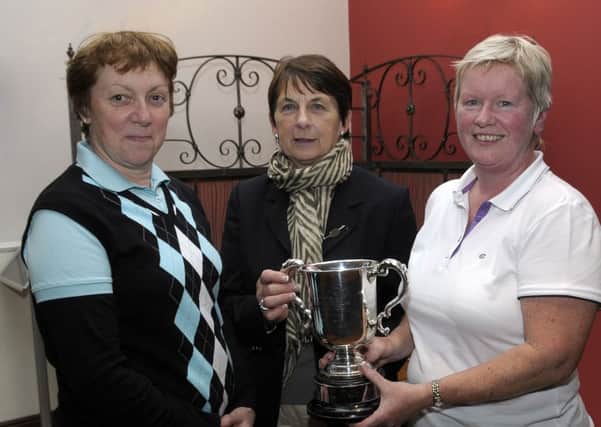 Lady Captain Robena McCandless presented The Challenge Cup to winner Fionnuala Crossey, included is runner up Susan Magennis © Edward Byrne Photography INBL28-207EB